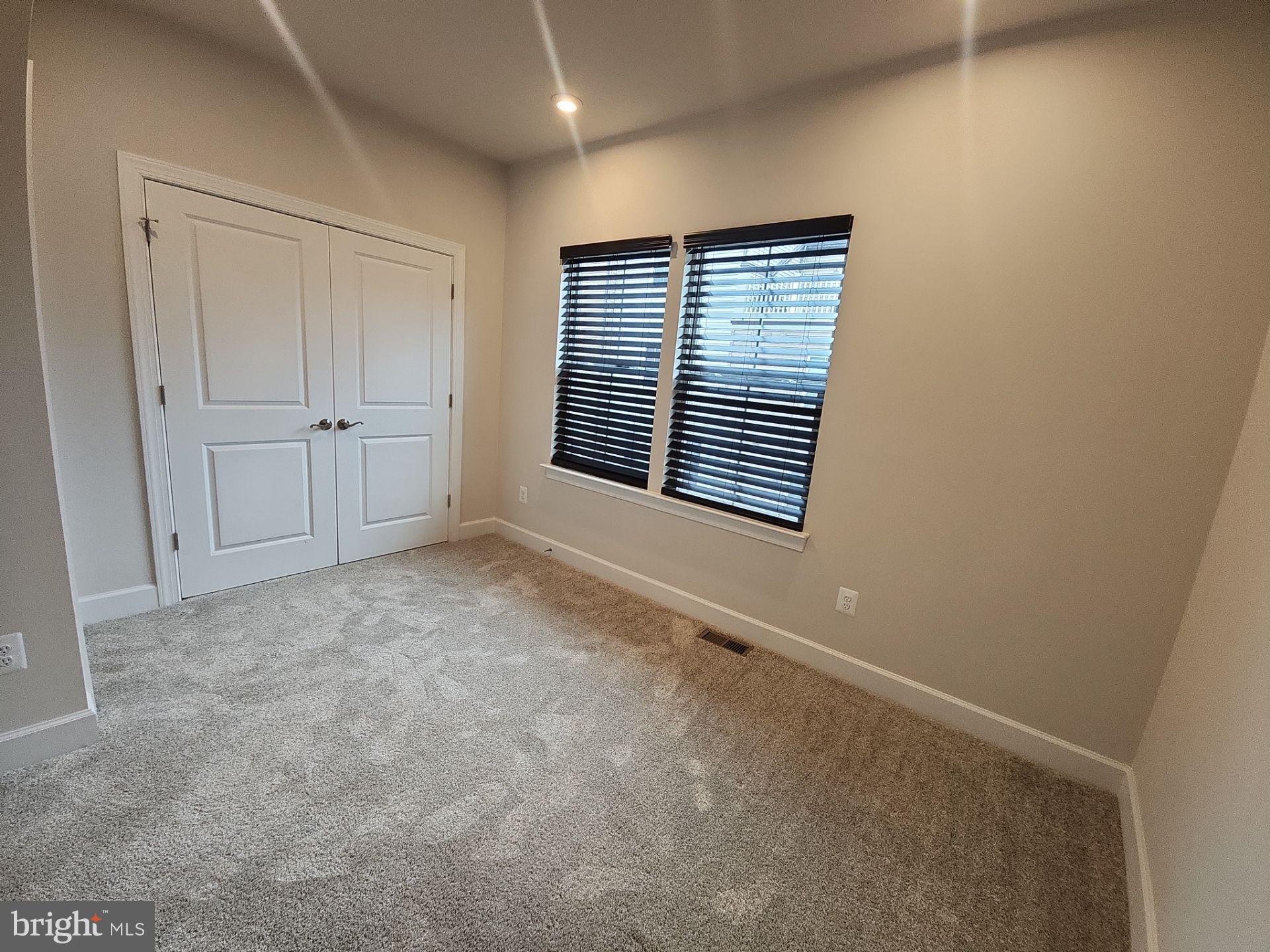 6730 Belcrest Road Hyattsville, MD 20782 - Photo 20 of 30 a view of an empty room with a window