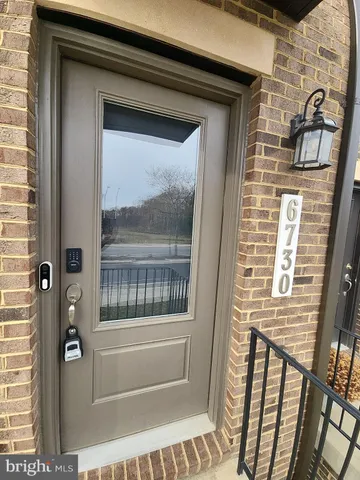 a view of a door and a window