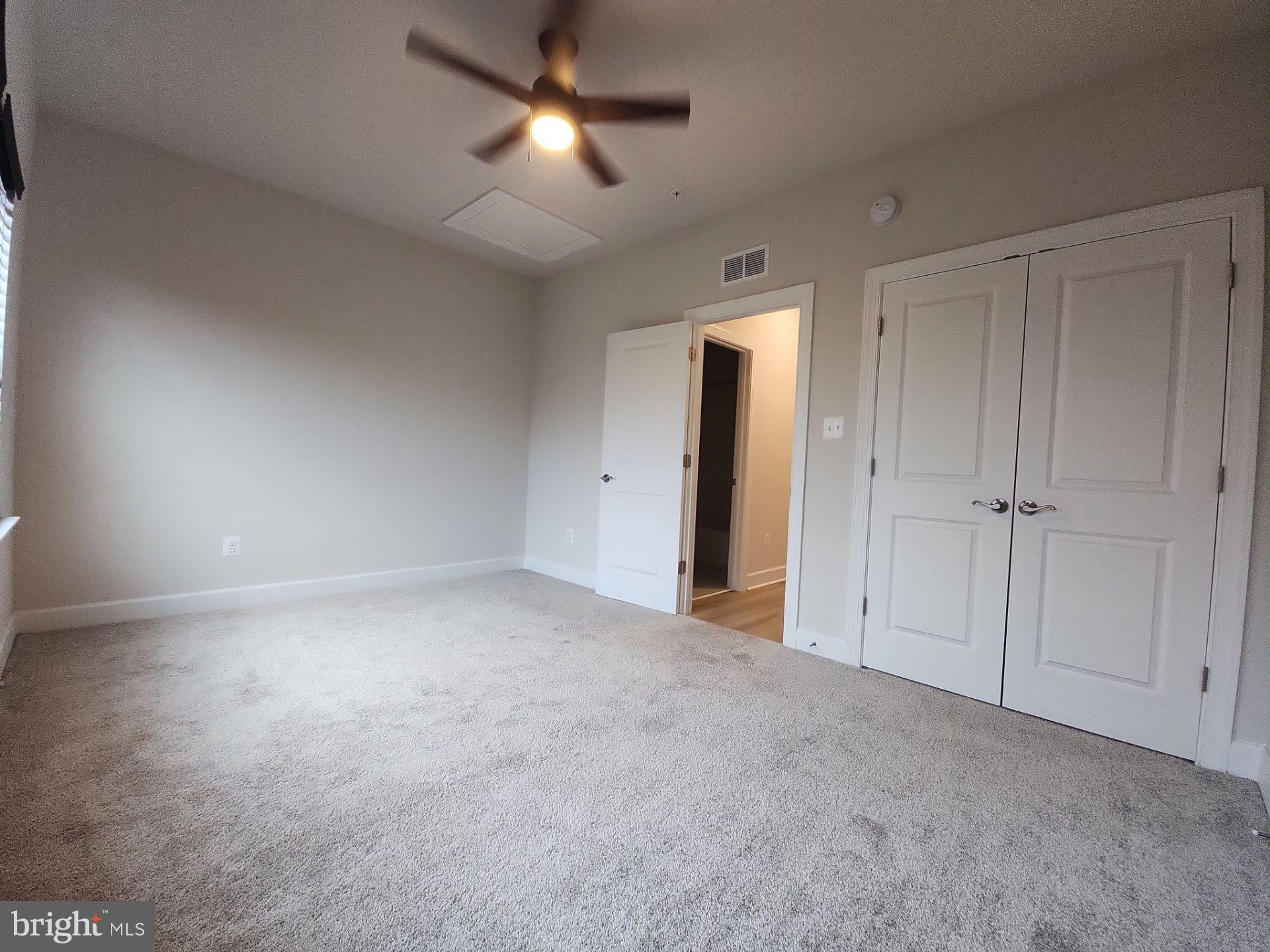 6730 Belcrest Road Hyattsville, MD 20782 - Photo 28 of 30 a view of an empty room and a ceiling fan