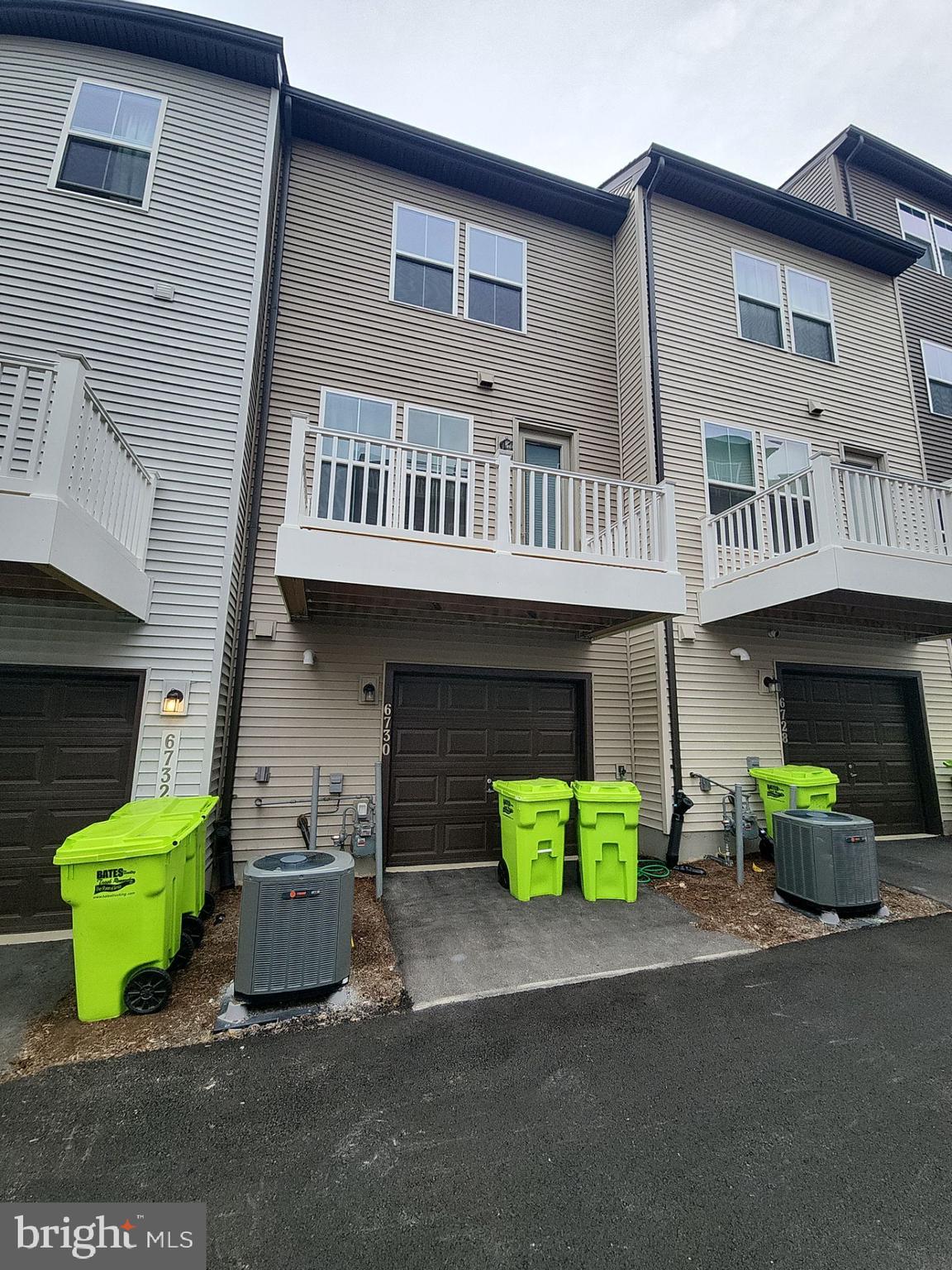 6730 Belcrest Road Hyattsville, MD 20782 - Photo 29 of 30 a front view of a house with a garden and garage