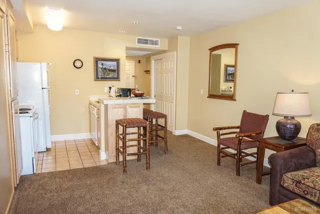 a living room with furniture and a table