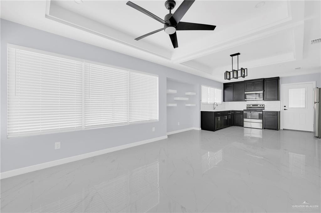 1612 Shadow Creek, Unit 1 Weslaco, TX 78596 - Photo 4 of 12 a view of kitchen with furniture and window