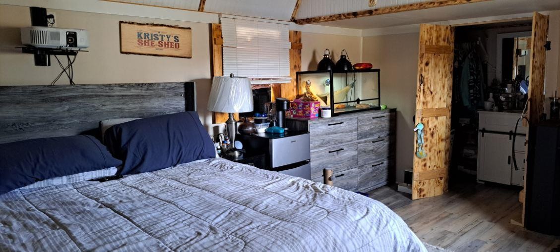 378 Sanders Road Decherd, TN 37324 - Photo 19 of 27 a bedroom with a bed and a mirror