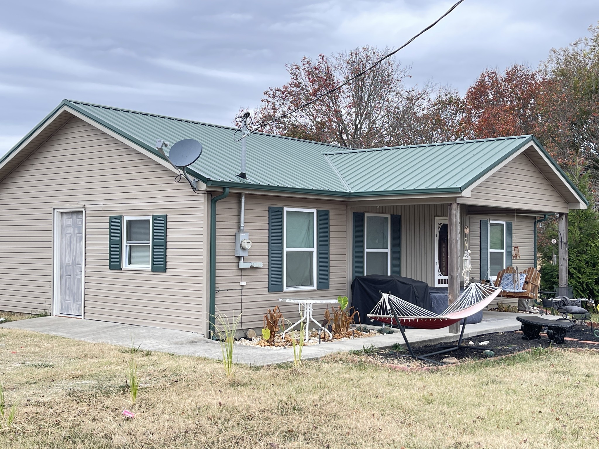 378 Sanders Road Decherd, TN 37324 - Photo 2 of 27 a view of a house with backyard porch and sitting area