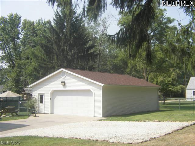 118 Canton Road Akron, OH 44312 - Photo 20 of 24 5 Car (30x40) heated garage w/ water, cable, phone, opener, (18x8) insulated door, 60 amp square D panel box & service door (2000)