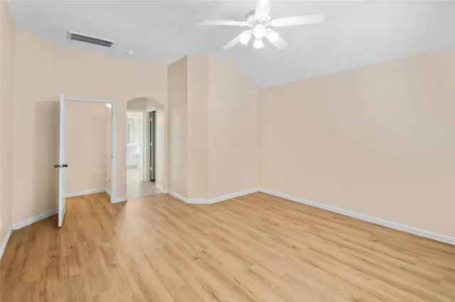 a bathroom with a double vanity sink a mirror and a bathtub