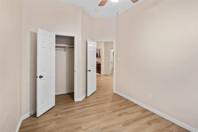 a view of hallway with wooden floor