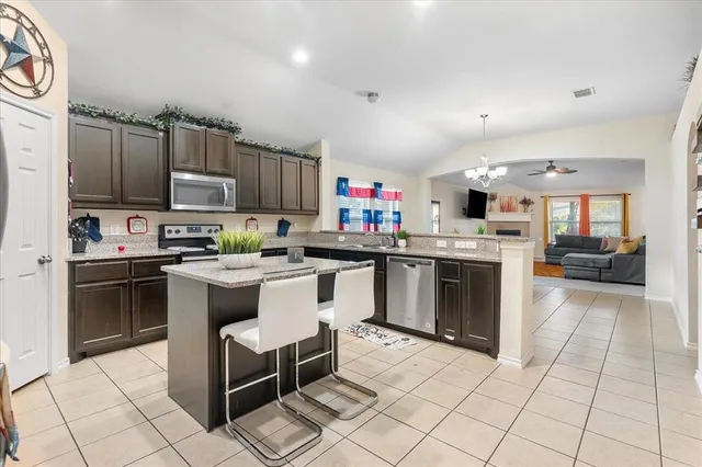 a view of backyard with a patio and a garden