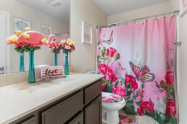 a bathroom with a sink a mirror and a toilet