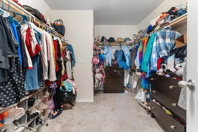 a bathroom with a granite countertop sink a mirror and a bathtub