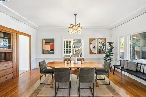 a view of a dining room with furniture window and outside view