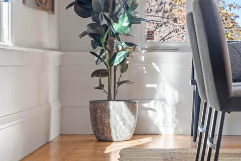 a kitchen with stainless steel appliances granite countertop a stove a sink and a refrigerator with wooden floor