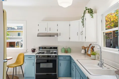 a kitchen with a stove and a refrigerator