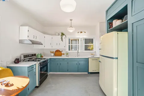 a kitchen with a faucet a sink and cabinets