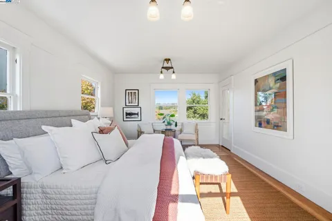 a bedroom with two beds and a window