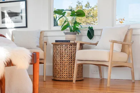 a bedroom with two beds and a chandelier