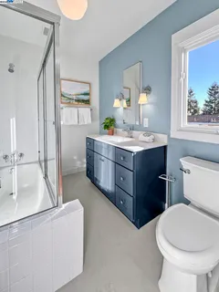 a bedroom with a bed and a lamp