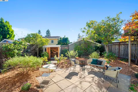 a view of a house with a yard and plants