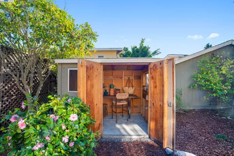 a view of a backyard with sitting area
