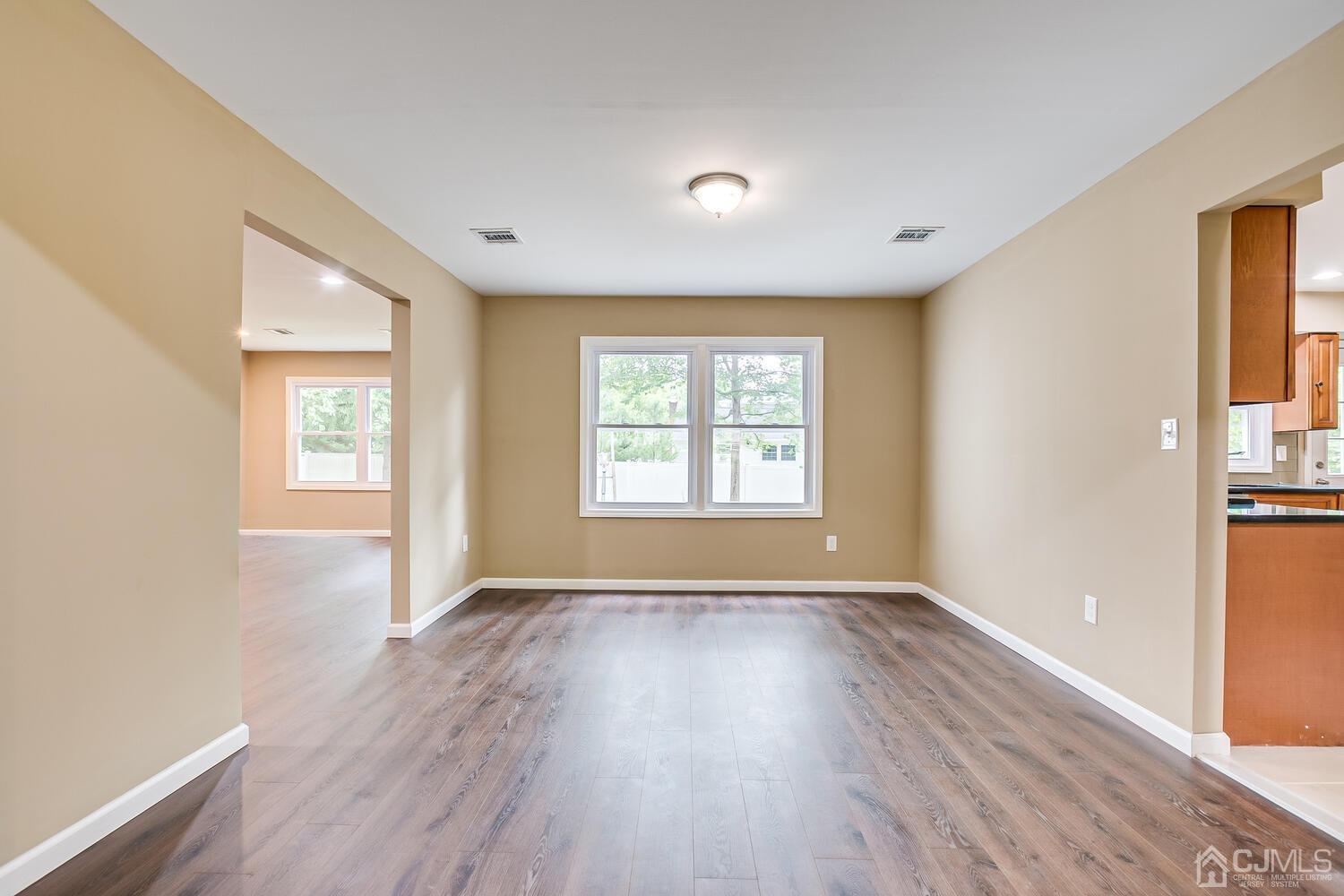 1 Lynnwood Road Edison, NJ 08820 - Photo 13 of 41 a view of an empty room with wooden floor and a window