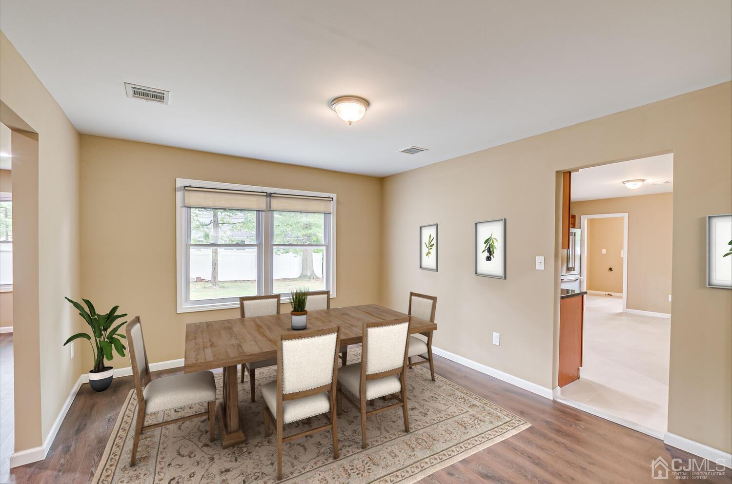 1 Lynnwood Road Edison, NJ 08820 - Photo 15 of 41 a view of a a dining room with furniture window and wooden floor