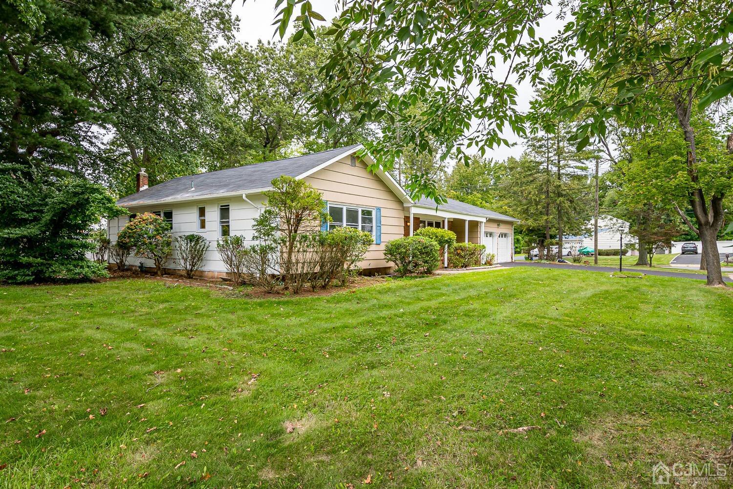 1 Lynnwood Road Edison, NJ 08820 - Photo 3 of 41 a front view of a house with garden