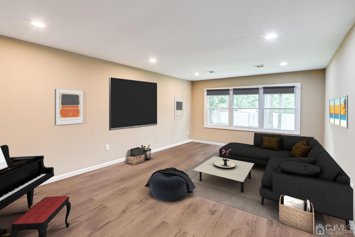 1 Lynnwood Road Edison, NJ 08820 - Photo 25 of 41 a living room with furniture and a flat screen tv