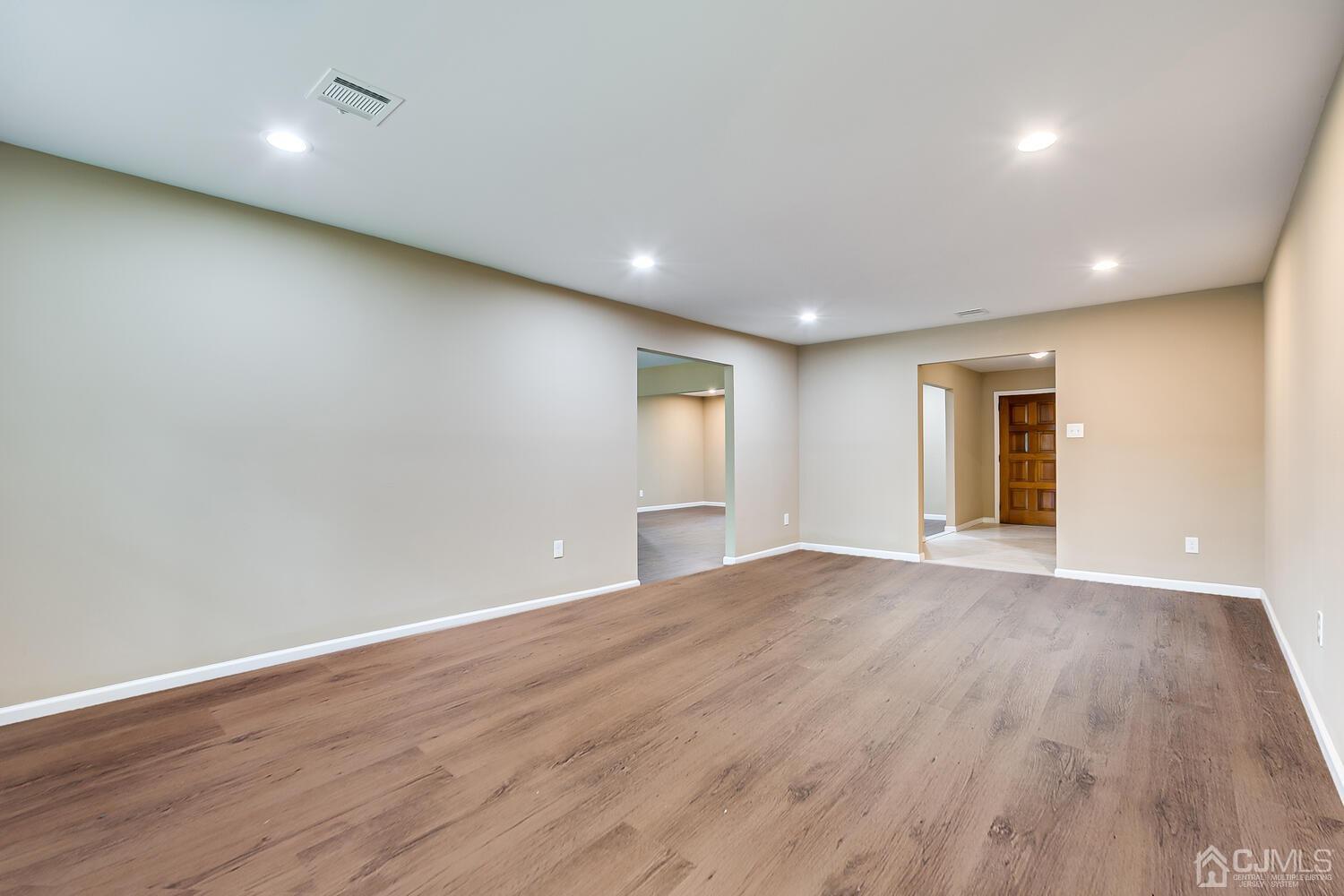 1 Lynnwood Road Edison, NJ 08820 - Photo 27 of 41 an empty room with wooden floor and windows