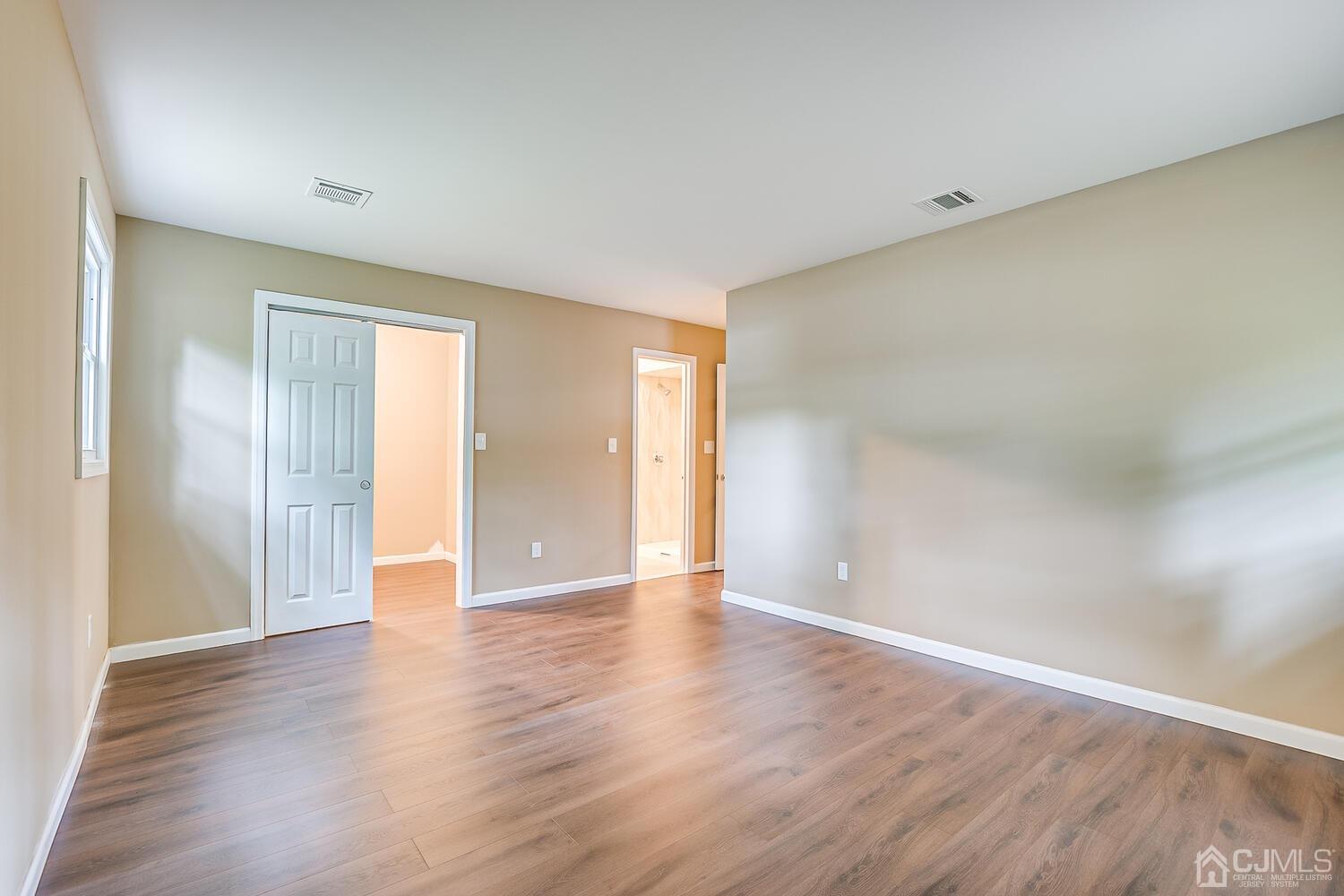 1 Lynnwood Road Edison, NJ 08820 - Photo 30 of 41 a view of an empty room with wooden floor