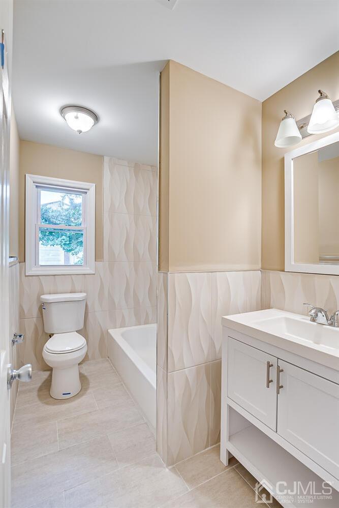1 Lynnwood Road Edison, NJ 08820 - Photo 37 of 41 a bathroom with a sink a toilet and shower