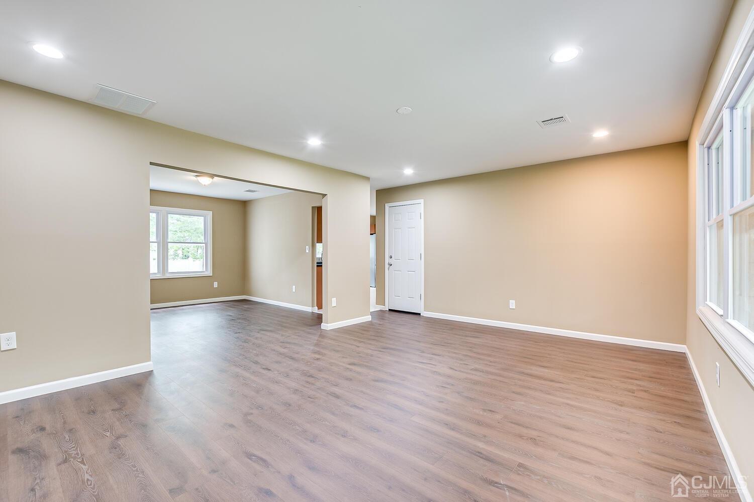 1 Lynnwood Road Edison, NJ 08820 - Photo 9 of 41 an empty room with wooden floor and windows