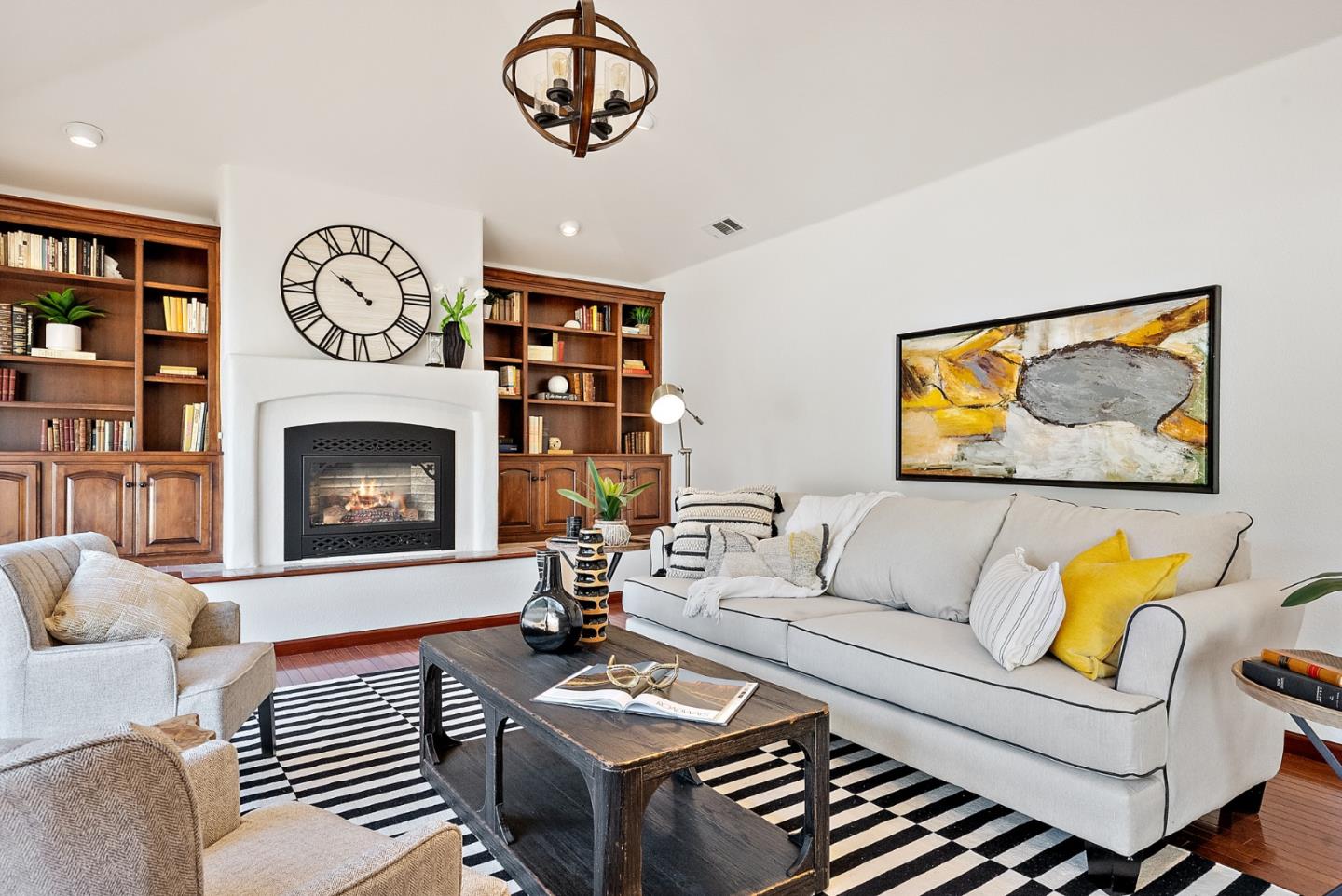 425 Covington Road Los Altos, CA 94024 - Photo 11 of 65 a living room with furniture a clock and a fireplace