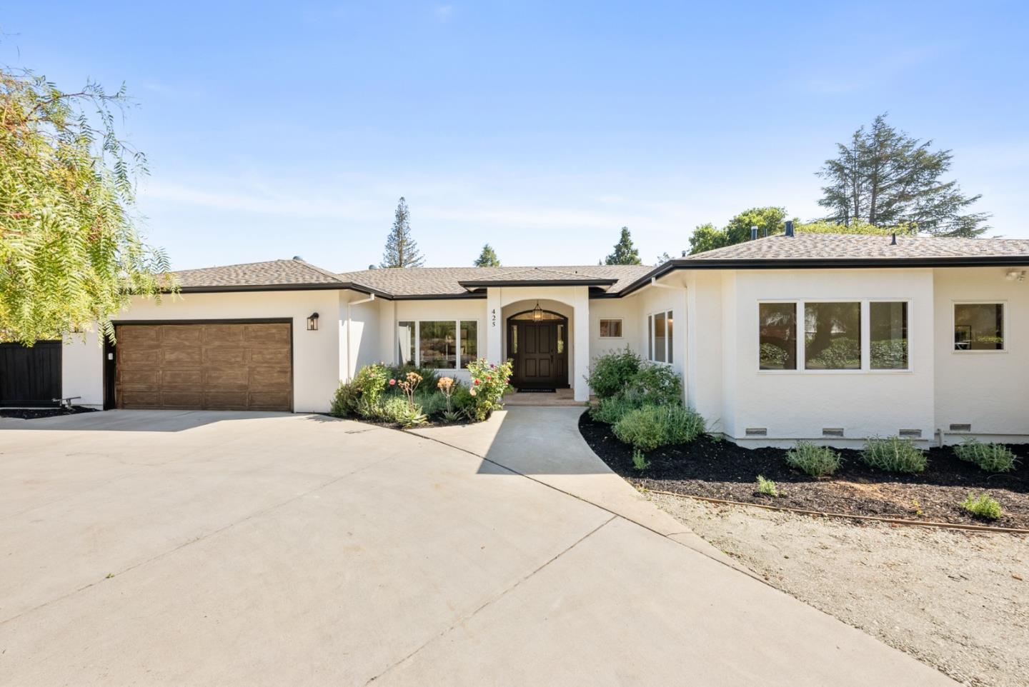 425 Covington Road Los Altos, CA 94024 - Photo 3 of 65 a front view of a house with a yard