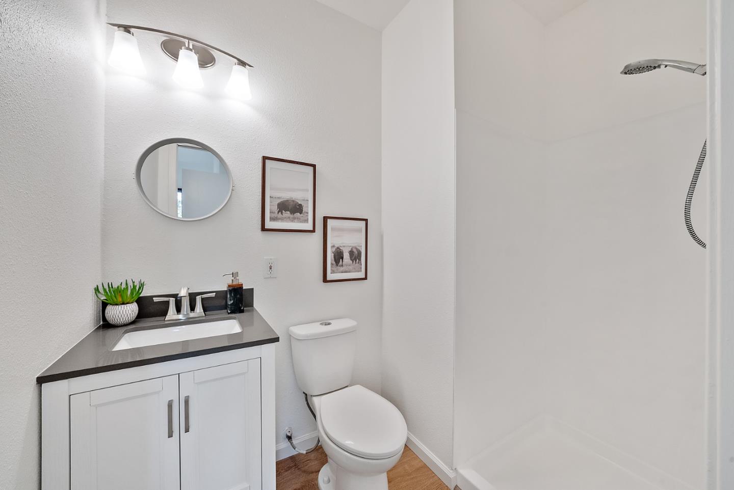 425 Covington Road Los Altos, CA 94024 - Photo 33 of 65 a bathroom with a toilet sink vanity and mirror