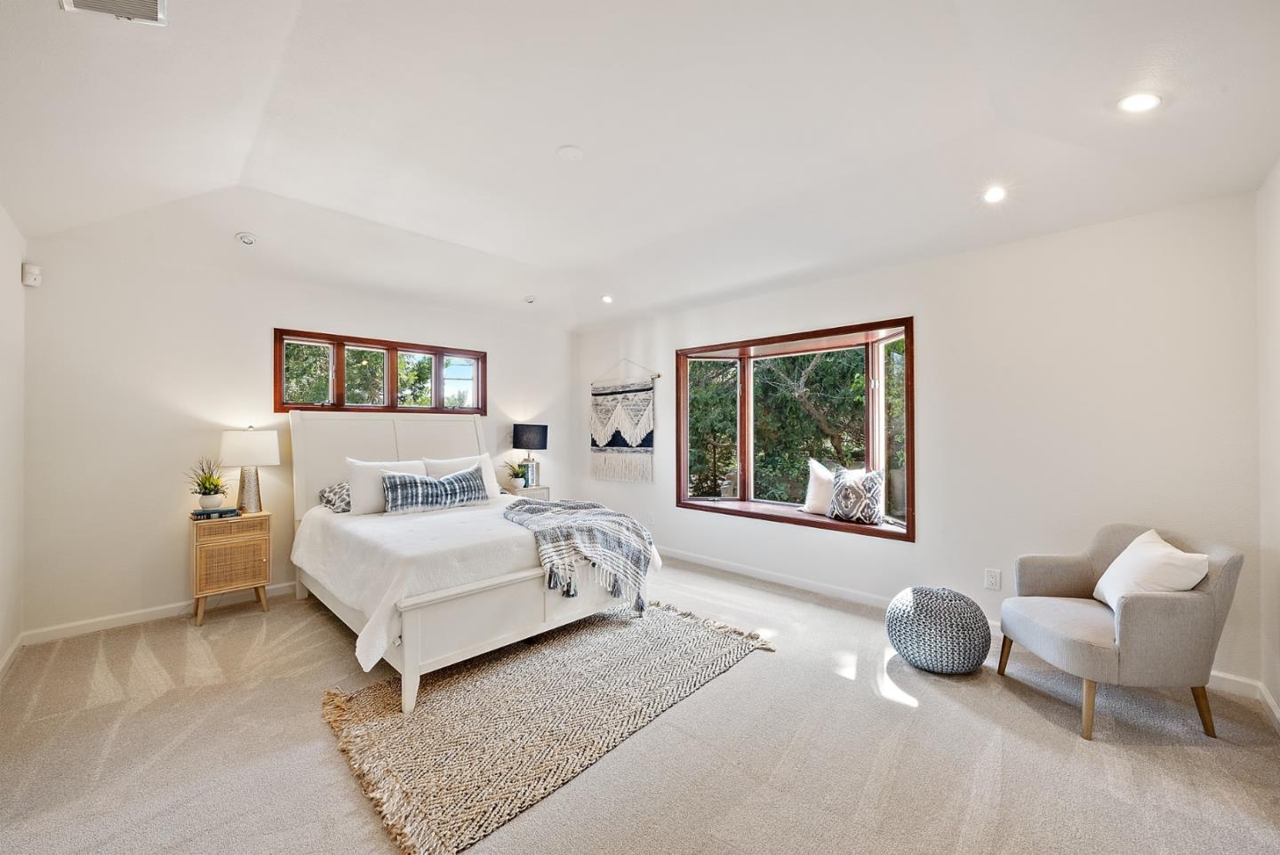 425 Covington Road Los Altos, CA 94024 - Photo 43 of 65 a spacious bedroom with a bed a couch and a window