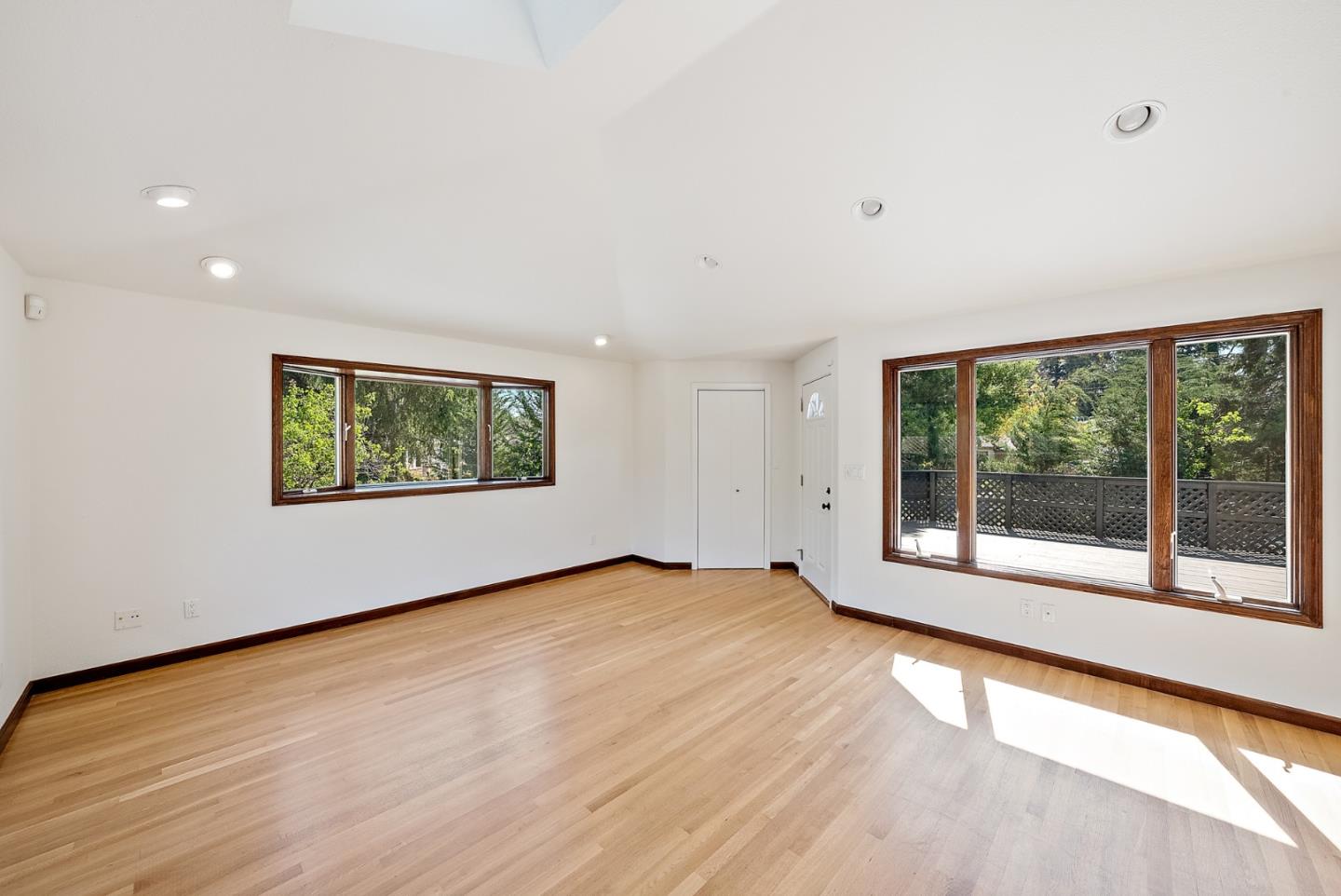 425 Covington Road Los Altos, CA 94024 - Photo 48 of 65 a view of an empty room with wooden floor and a window