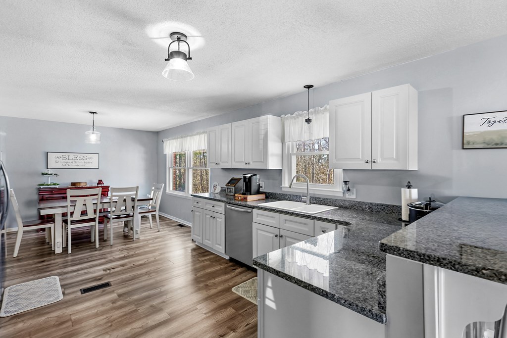 202 Wilton Road Abbeville, SC 29620 - Photo 17 of 35 This spacious kitchen offers a seamless flow into the dining area, perfect for gatherings.