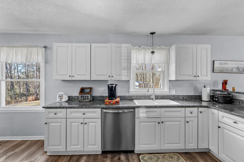 202 Wilton Road Abbeville, SC 29620 - Photo 19 of 35 This bright kitchen features ample cabinetry and a practical layout for daily living.