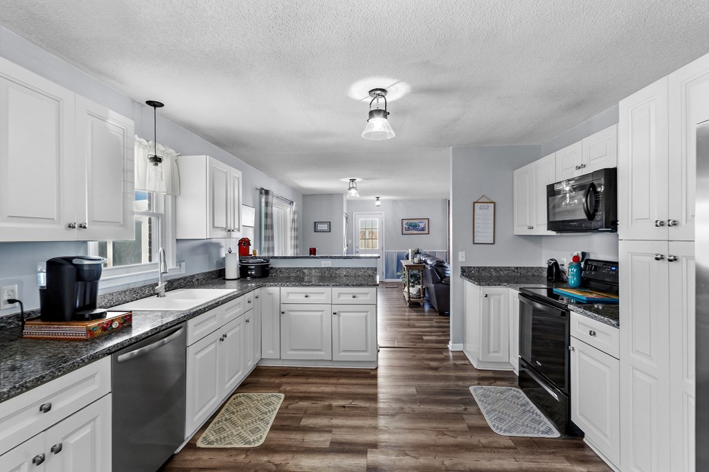 202 Wilton Road Abbeville, SC 29620 - Photo 20 of 35 This bright kitchen features ample counter space and modern appliances for seamless meal preparation.