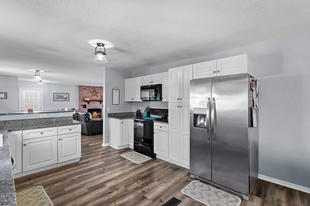 202 Wilton Road Abbeville, SC 29620 - Photo 21 of 35 This modern kitchen features stylish finishes and an inviting open concept layout.