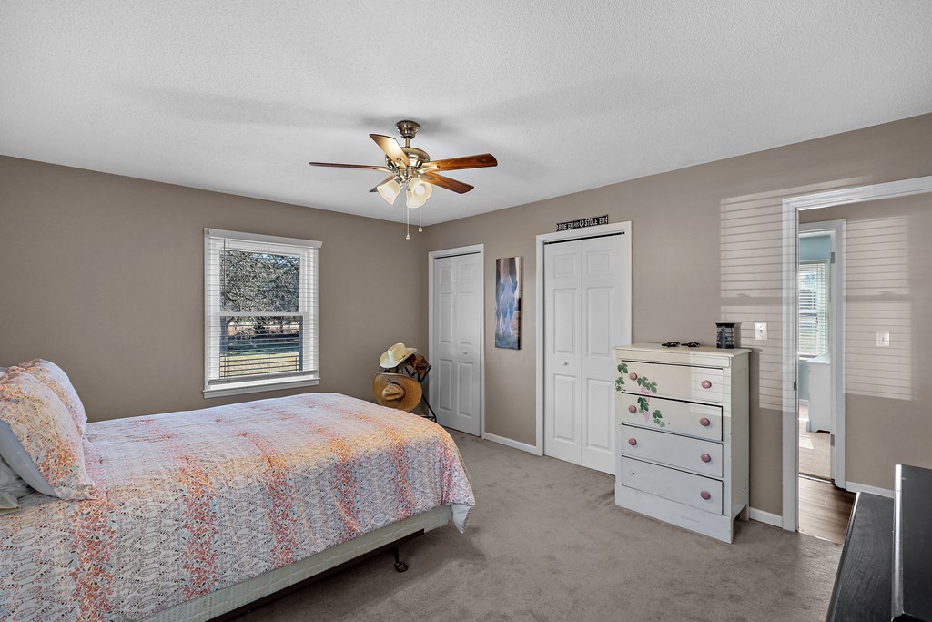 202 Wilton Road Abbeville, SC 29620 - Photo 24 of 35 This spacious bedroom offers ample natural light and a comfortable retreat for relaxation.