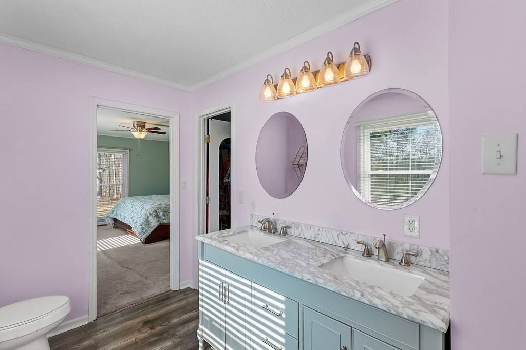 202 Wilton Road Abbeville, SC 29620 - Photo 26 of 35 This primary bathroom features a dual vanity, elegant countertops, and modern flooring.