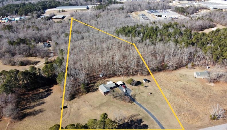 202 Wilton Road Abbeville, SC 29620 - Photo 34 of 35 Aerial view of a home nestled on a large, wooded lot with ample privacy.