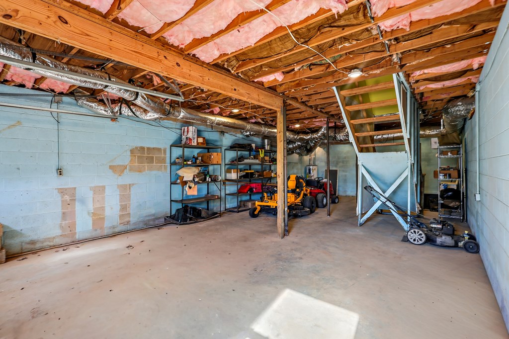 202 Wilton Road Abbeville, SC 29620 - Photo 9 of 35 This spacious unfinished basement offers ample storage and versatile expansion possibilities.