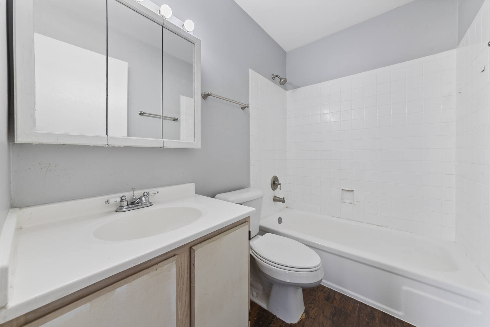 2400 Light Road, Unit 212 Oswego, IL 60543 - Photo 12 of 14 a bathroom with a sink a toilet and bathtub