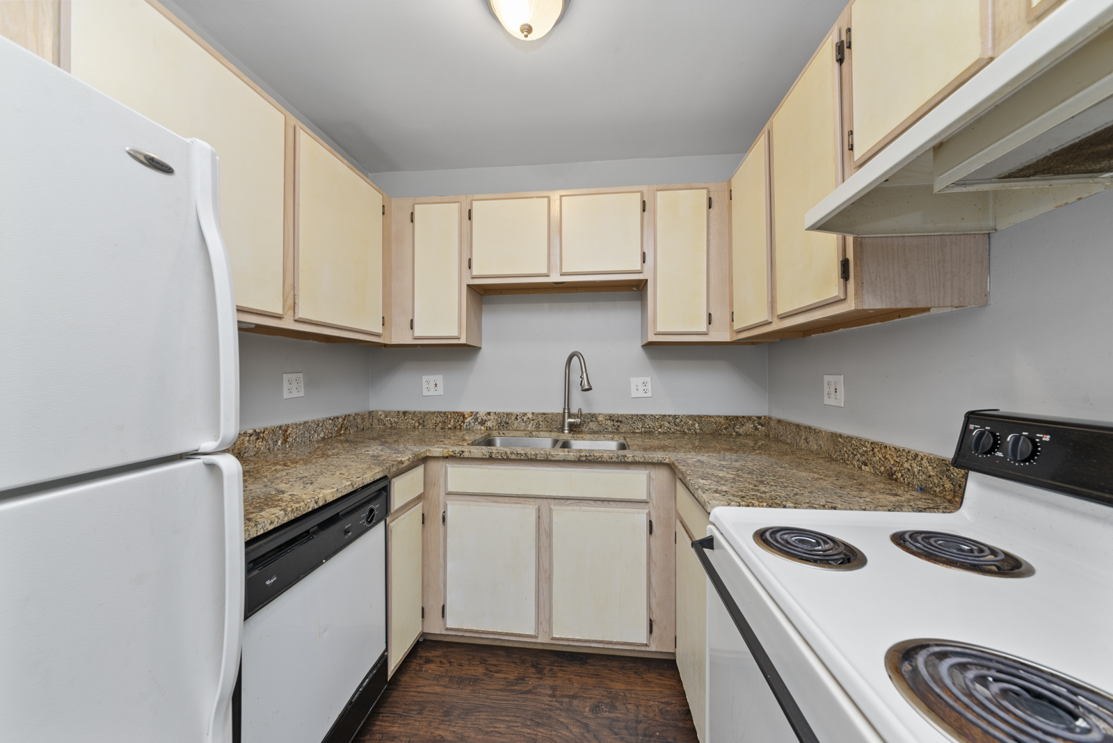 2400 Light Road, Unit 212 Oswego, IL 60543 - Photo 8 of 14 a kitchen with granite countertop a sink stove and cabinets