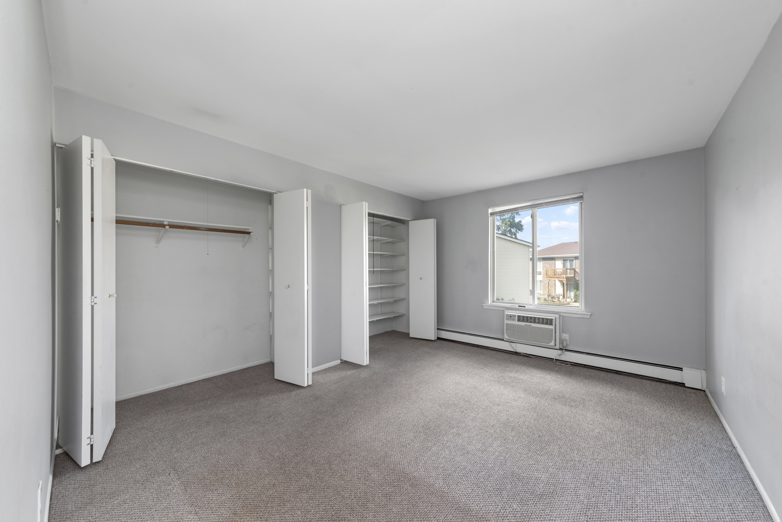 2400 Light Road, Unit 212 Oswego, IL 60543 - Photo 9 of 14 an empty room with a window and closet area