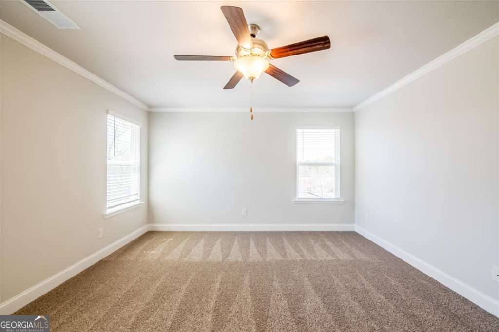 219 Carsons Walk Macon, GA 31206 - Photo 27 of 57 an empty room with windows and fan