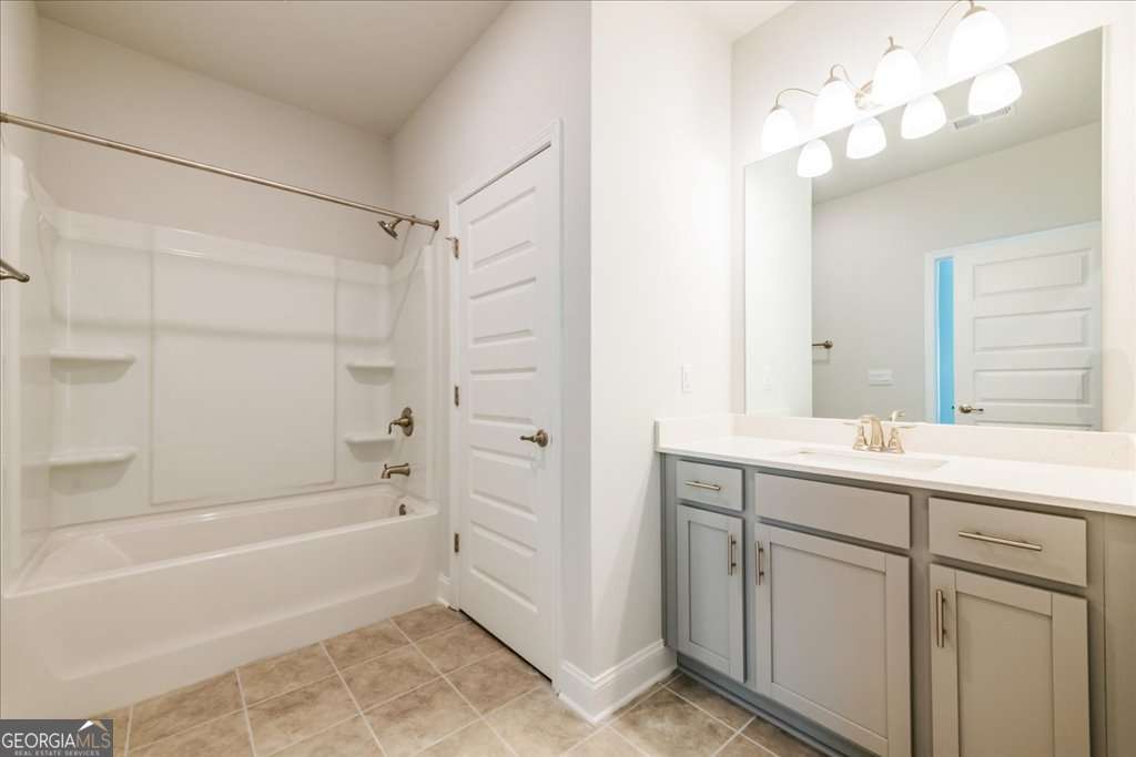 219 Carsons Walk Macon, GA 31206 - Photo 50 of 57 a bathroom with a bathtub a sink a vanity and a shower