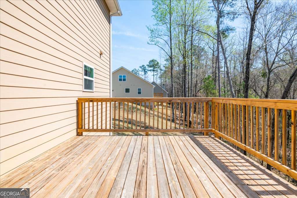 219 Carsons Walk Macon, GA 31206 - Photo 53 of 57 a view of a wooden deck with a yard